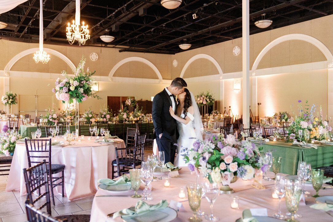 husband and wife, pink and green linens, garden arrangement, bridgerton wedding