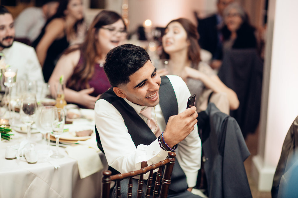 Wedding Photograph Of Man In Gray Suit Taking a Picture Los Angeles