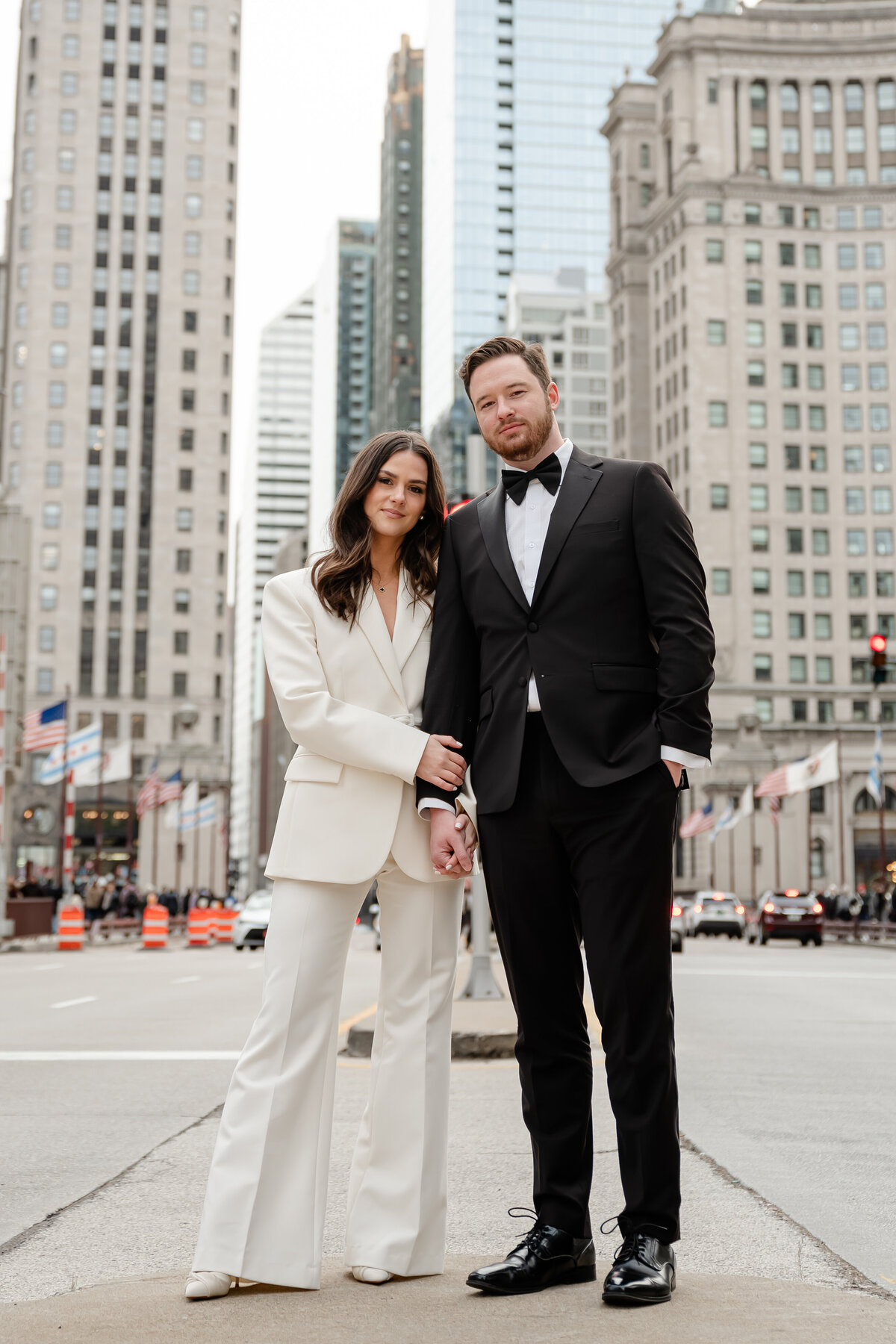 A couple stand in the middle of Michigan Ave. 