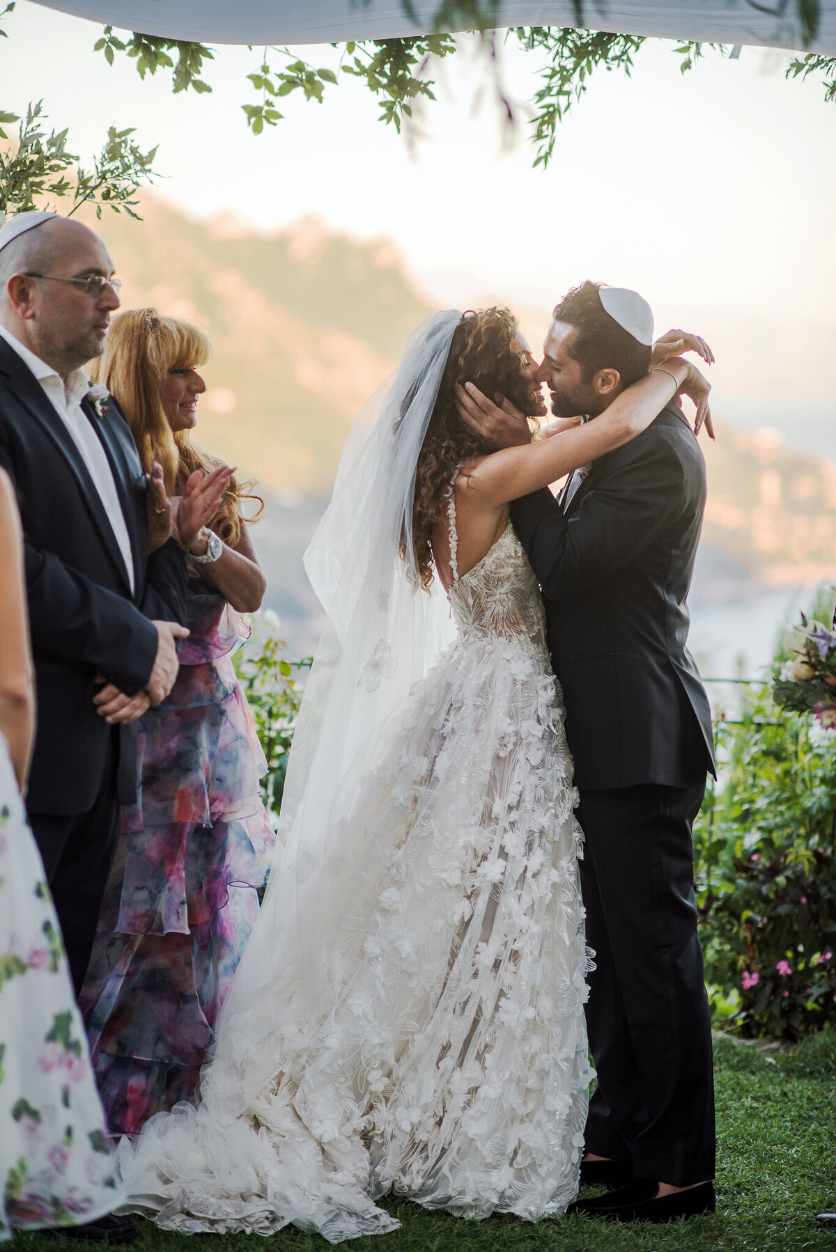 Newlyweds kiss after the wedding ceremony