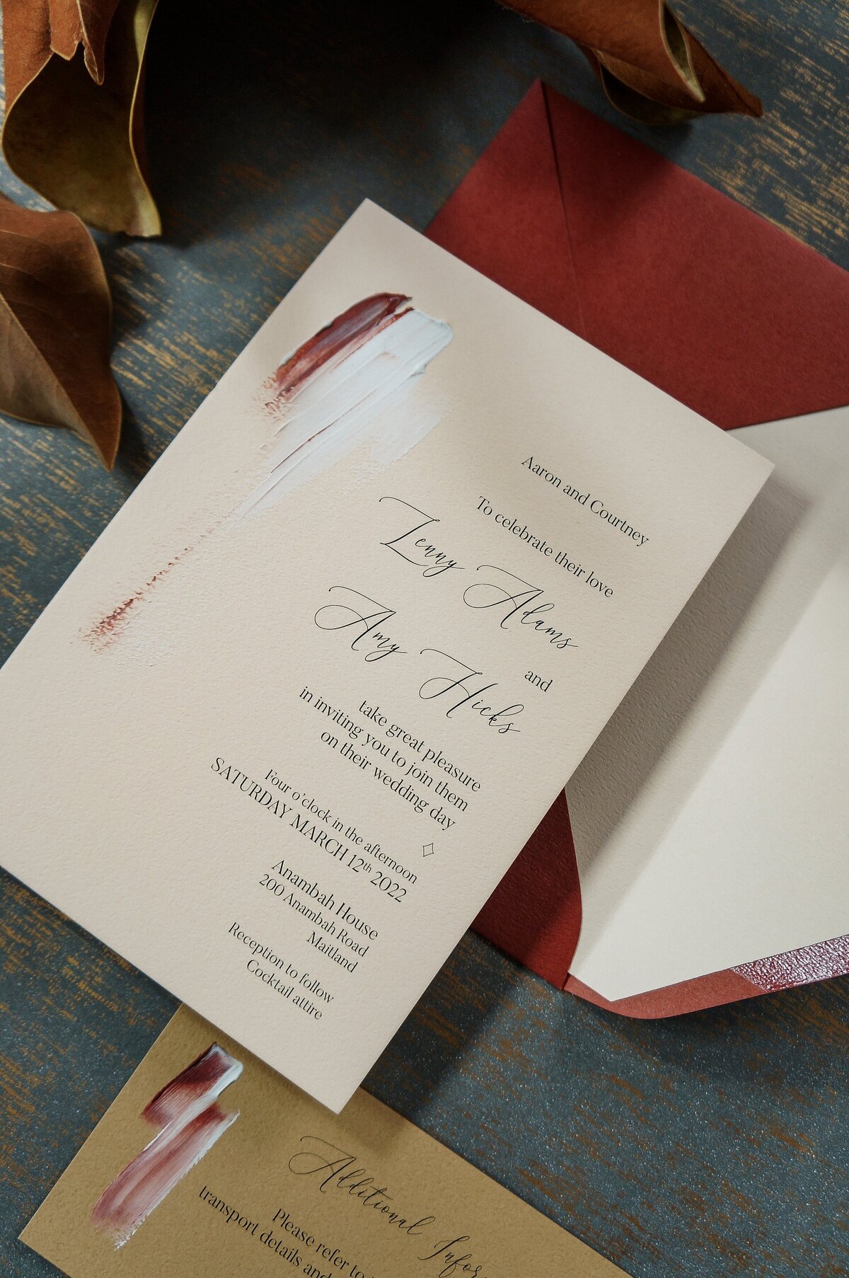 Red artistic wedding invitation with natural red and brown colours