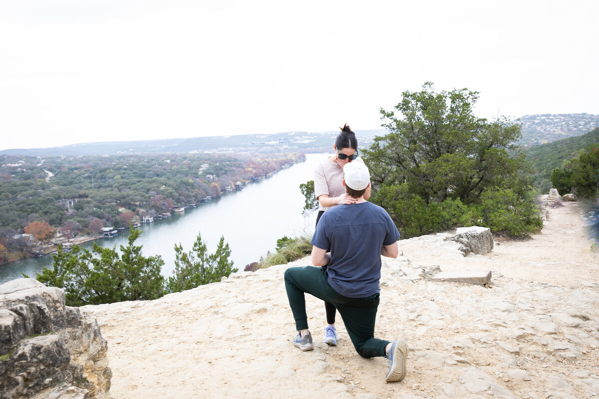 An Austin wedding photographer captures a mountain-top proposal moment between a man and woman.