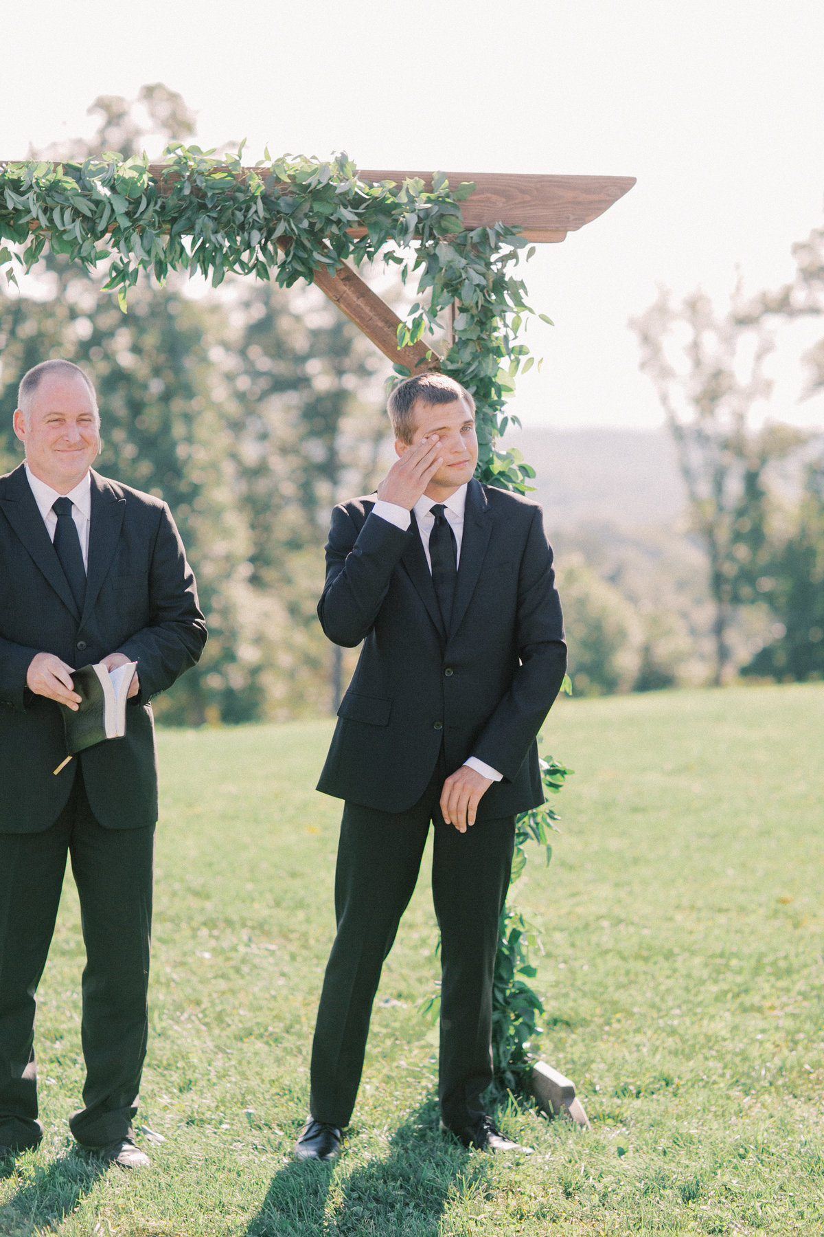 groom getting emotional seeing bride walk down aisle