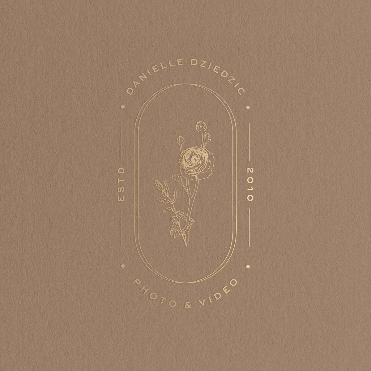 a mockup of a stamp logo with a rose illustration in gold foil