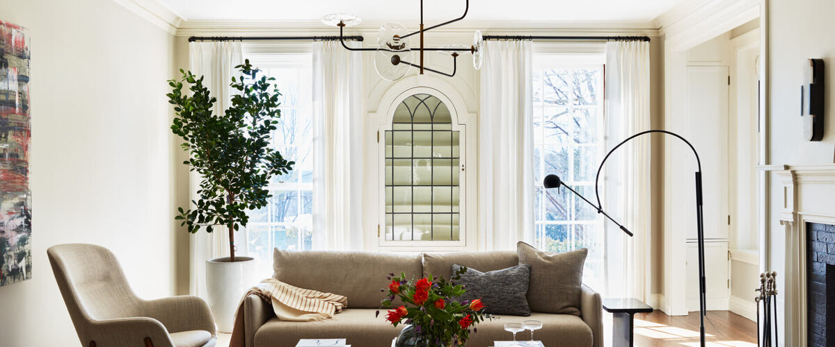 This historic home living room by Sarah Scales was featured in local and national magazines, in print and online, showcasing timeless interior design.