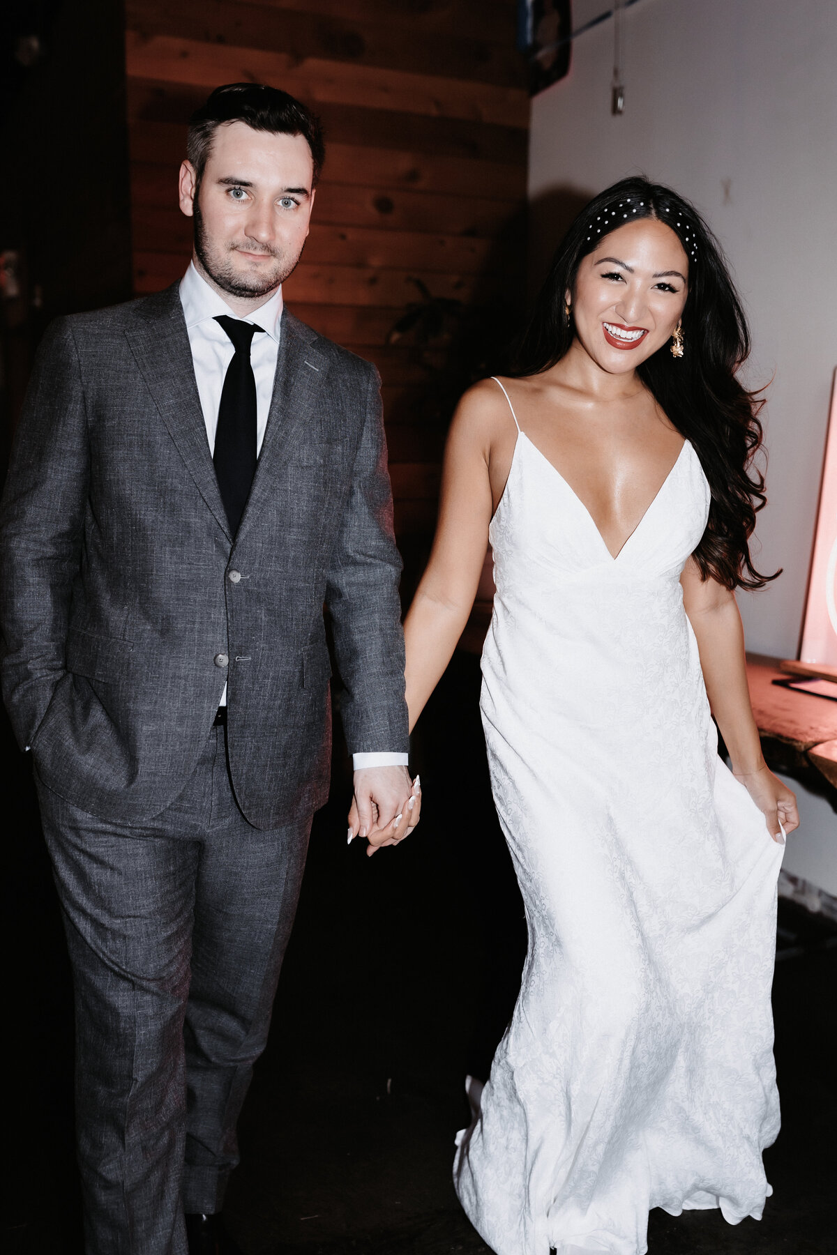 Bride and groom walking hand in hand