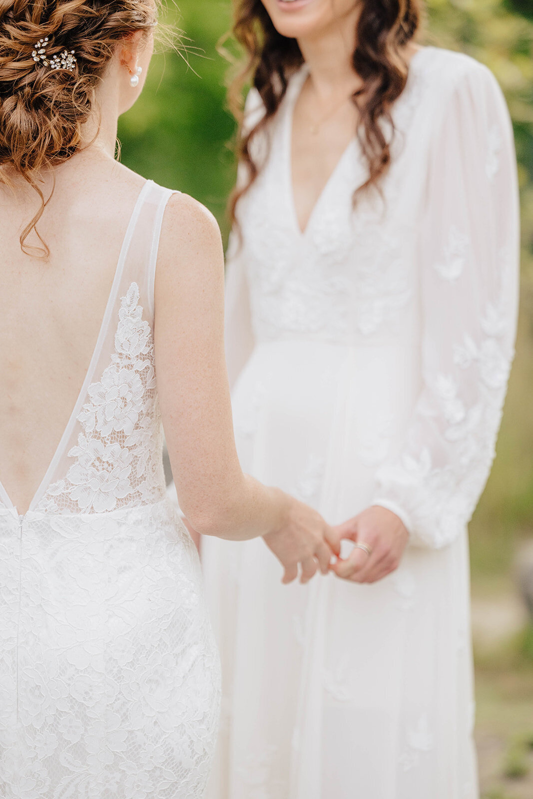 Brides holding hands at Cornell University wedding