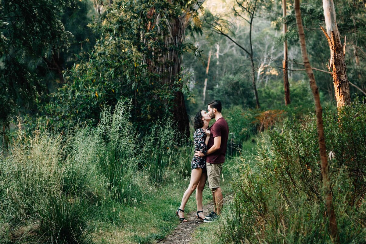 Teenage couple photoshoot in Melbourne bushland with couple kissing, And So I Don't Forget Photography