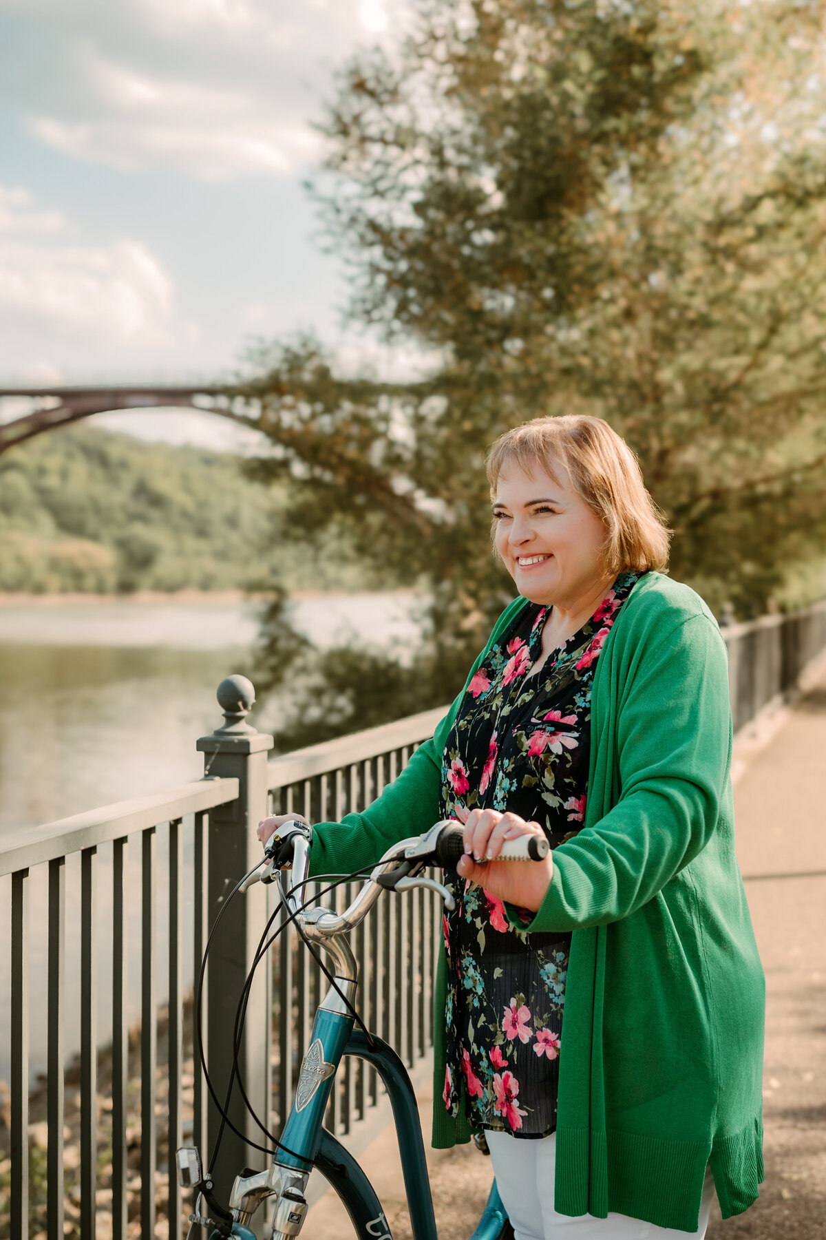 Relaxed and candid online dating photo of woman walking along river trail in Minneapolis