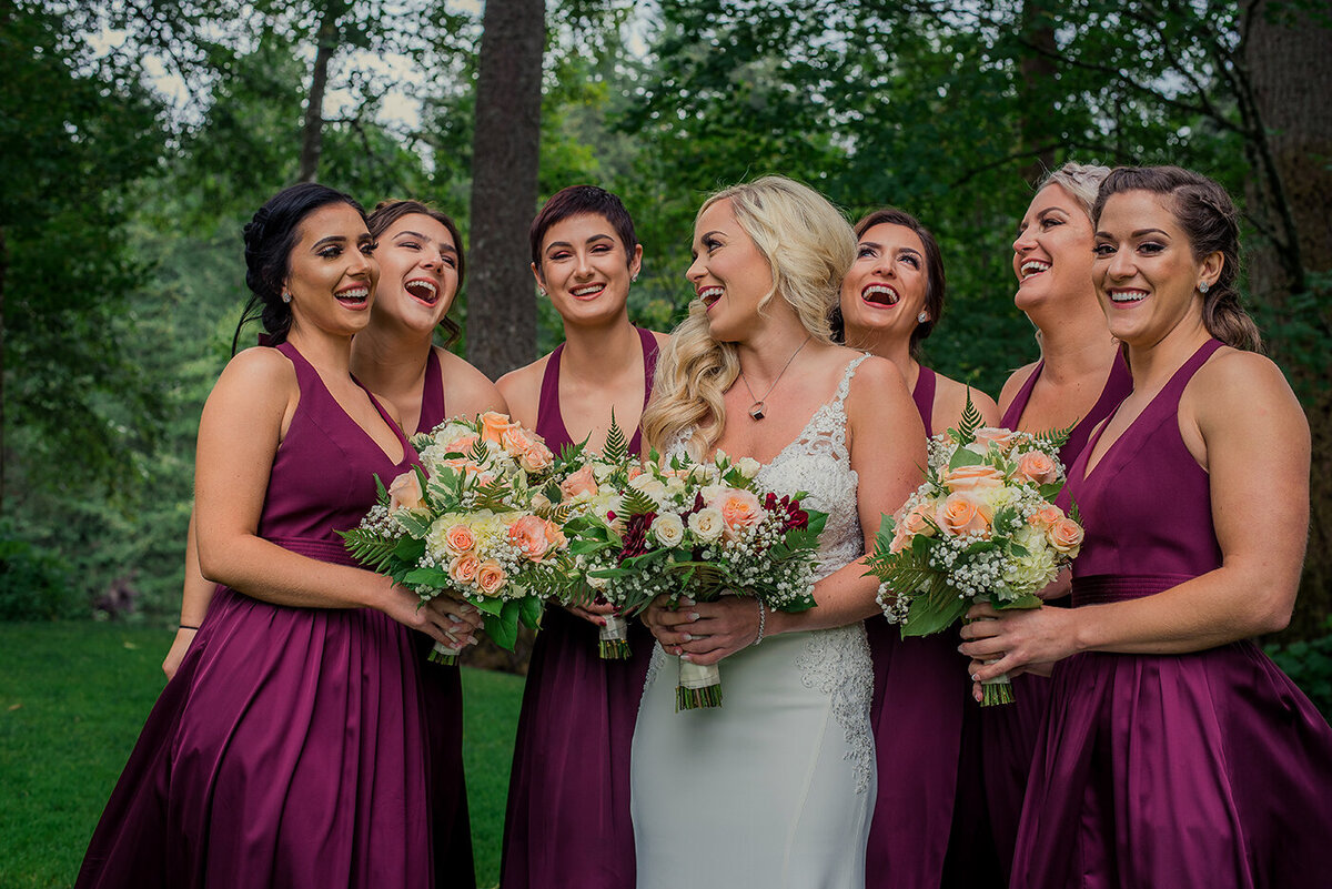 bridesmaids happy with bride