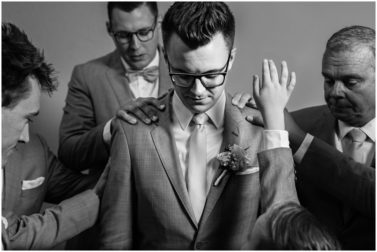 Groomsmen praying over Groom at Oak Hills Reception and Event Center