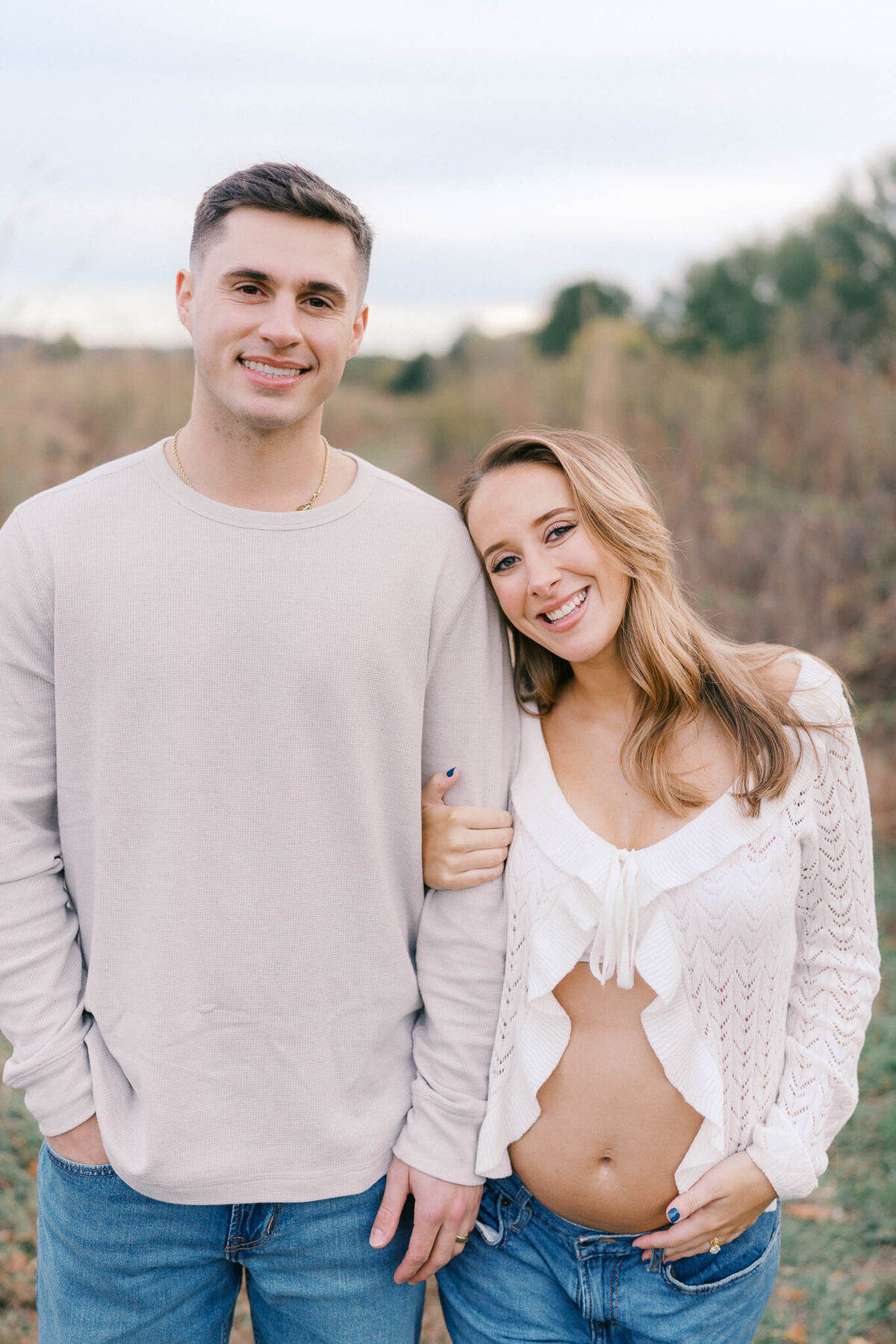 man and woman hug at seven islands state birding park in october near knoxville tennessee