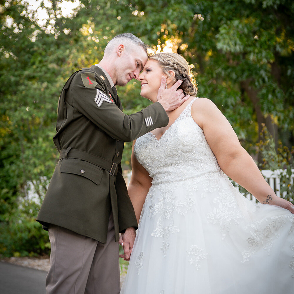 bride and groom leaning toward each other with big smiles