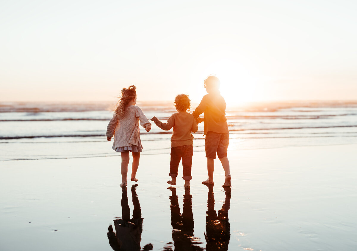 Family photo session in Seabrook, Washington during golden hour. Ashtyn Kohler Photography specializes in newborn and family photography in Olympia, Washington, and surrounding areas. Capture timeless, light, and airy portraits that beautifully preserve the fleeting moments of your baby's early years with a natural, heartfelt approach.