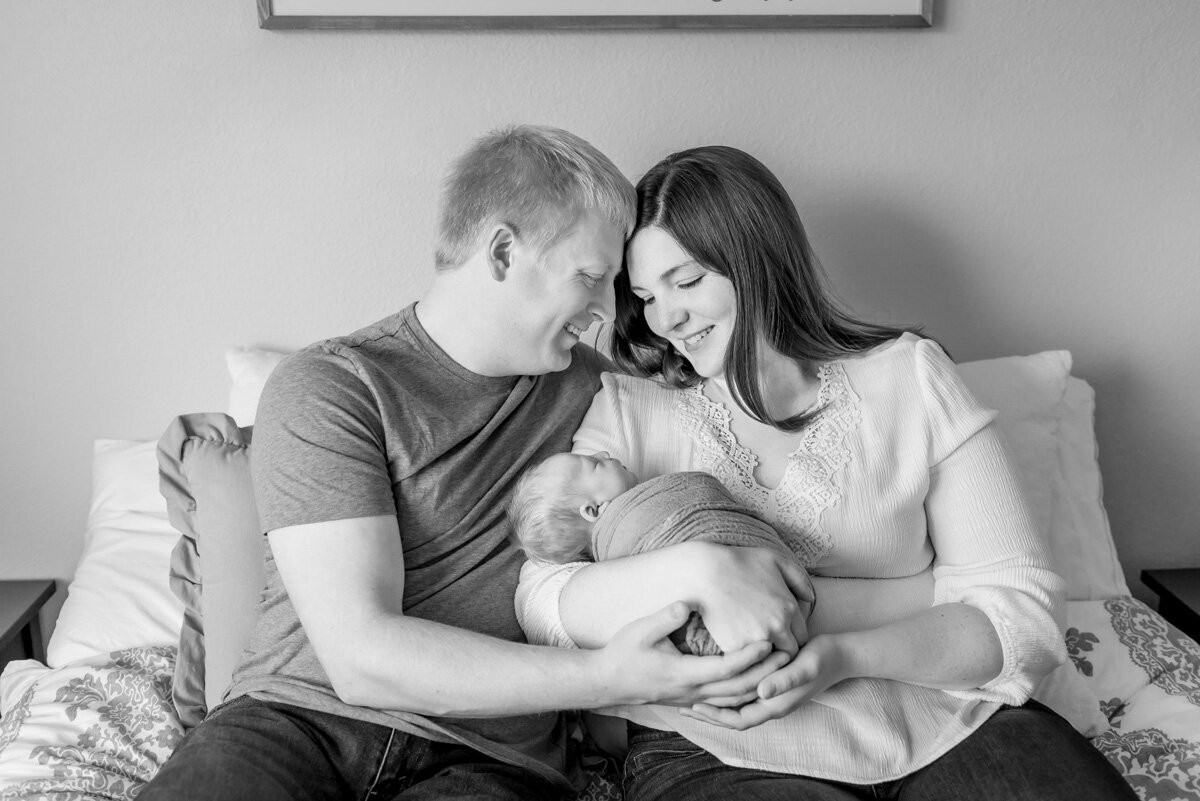 denver-new-baby-in-home-session-new-parents-snuggle