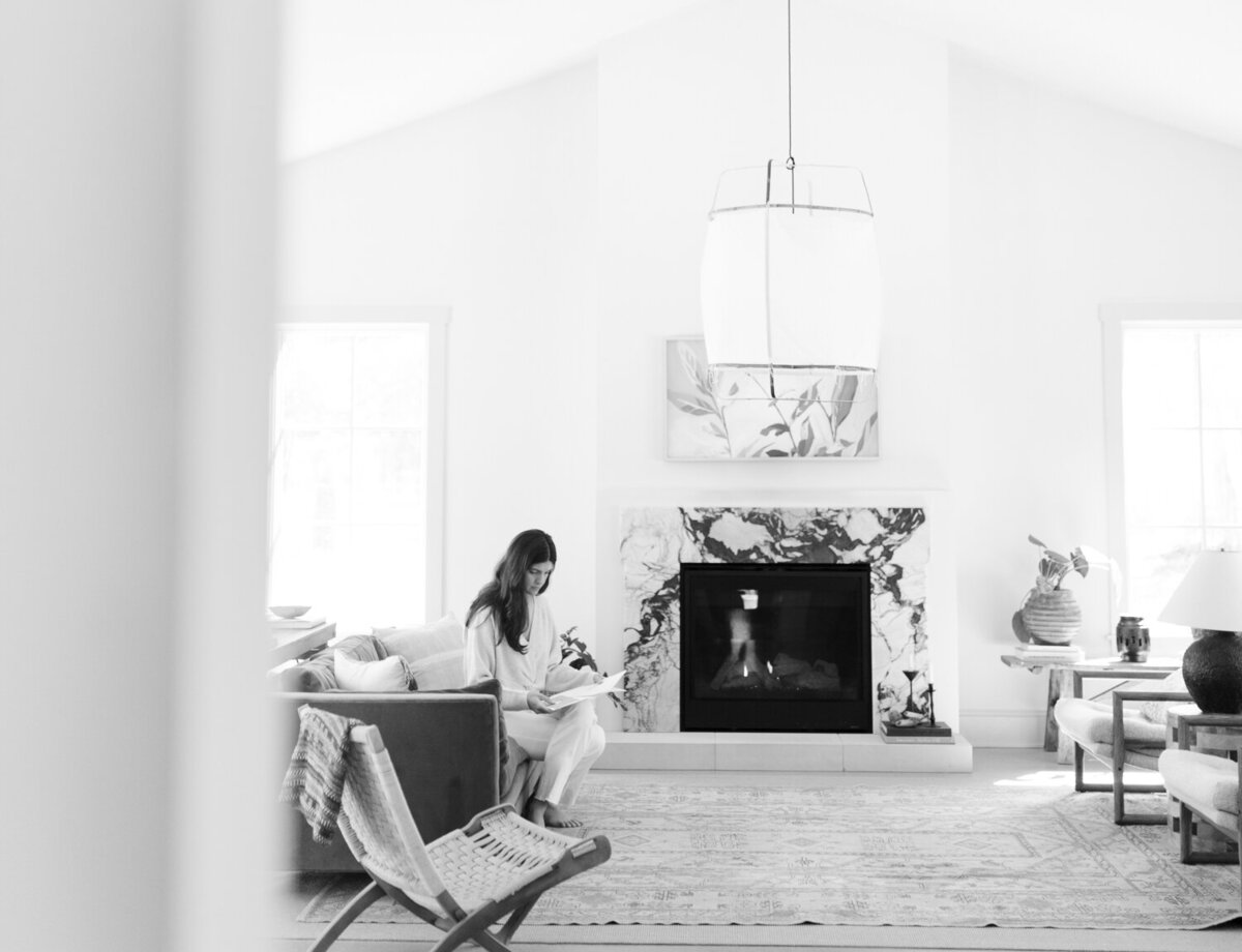 relaxed designer works at Fernhaus, Northern Michigan during her film branding photos