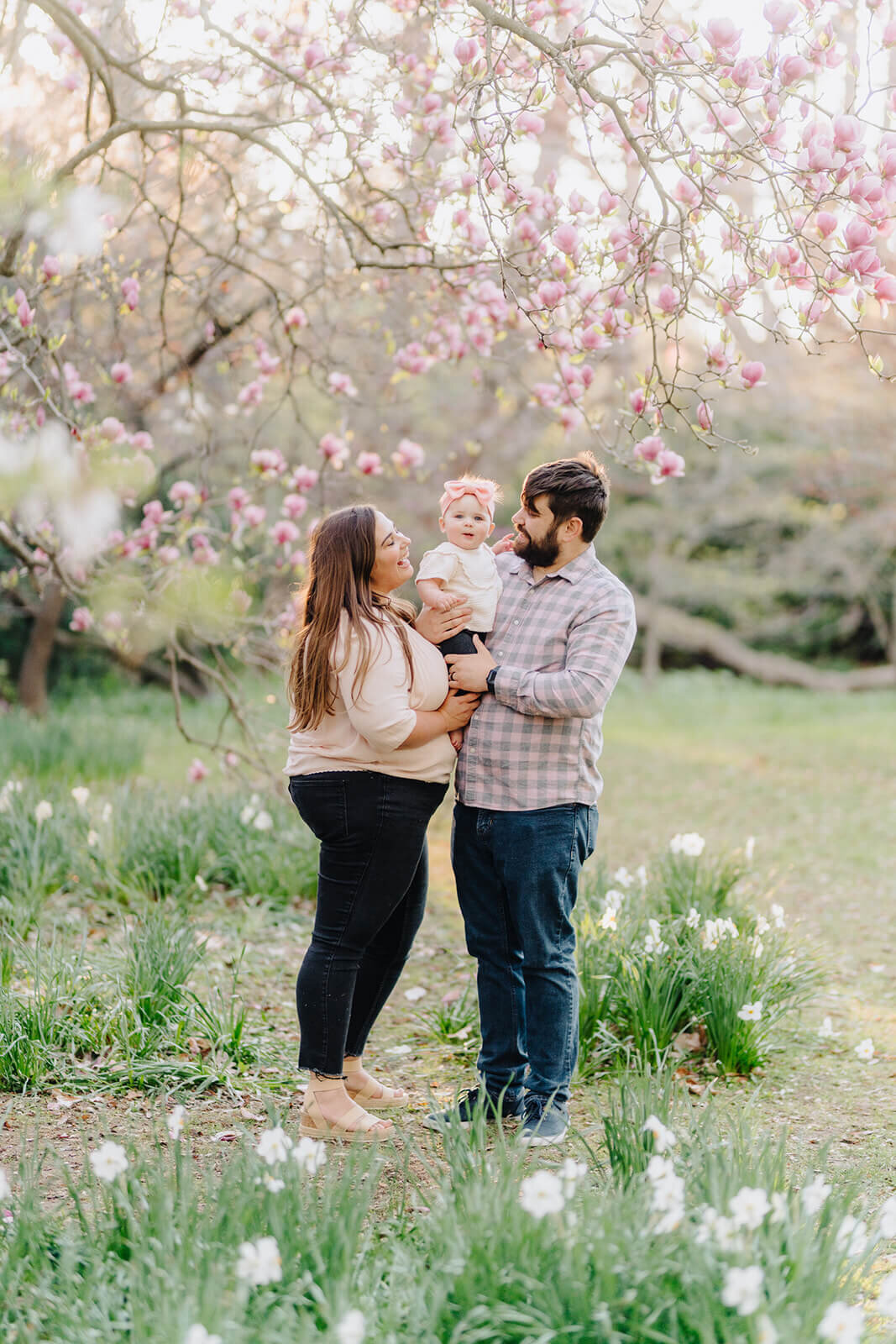 couple holding a baby for family photography session at Finger Lakes New York
