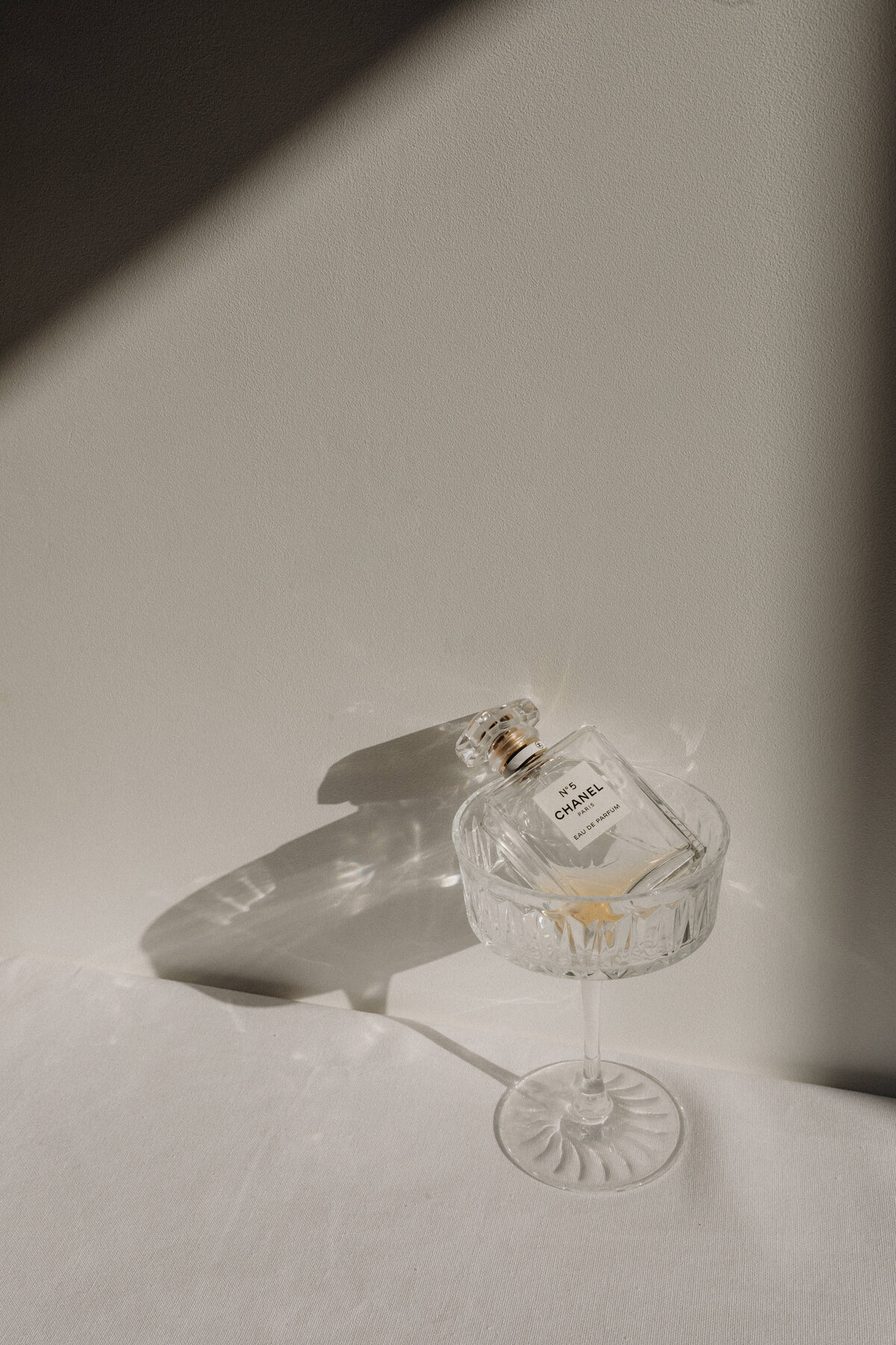 kaboompics_refined-aromas-perfume-bottles-cast-in-shadows-and-light-35447
