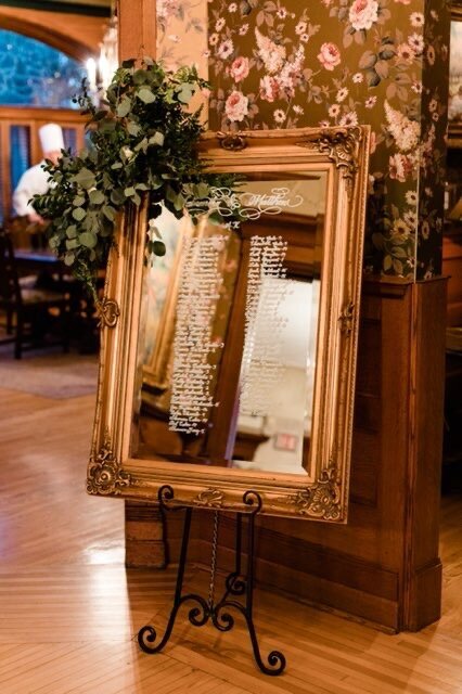 vintage wedding mansion seating chart gold mirror