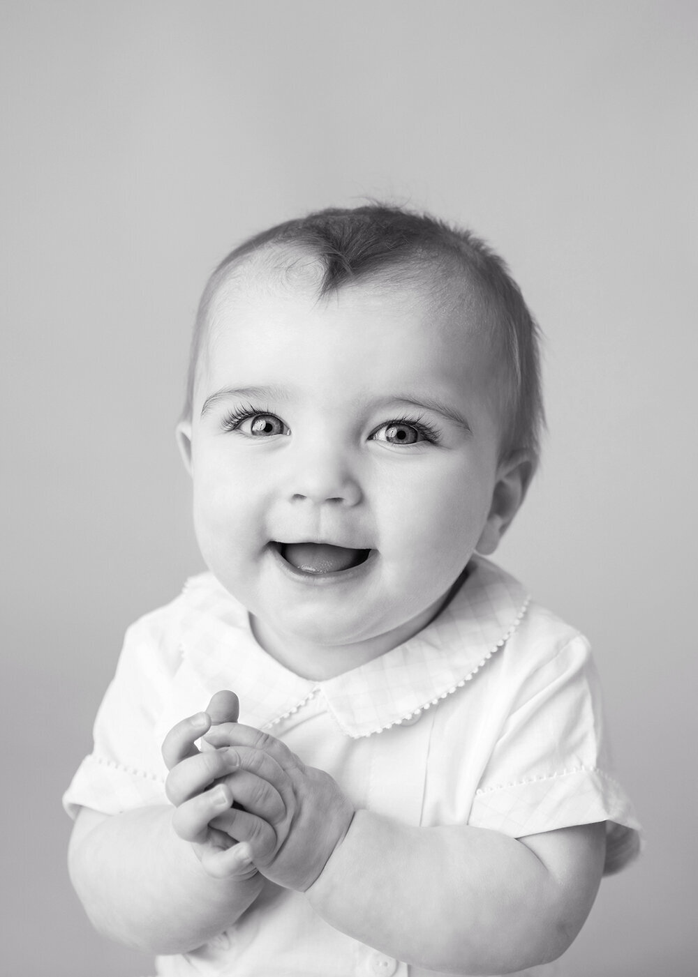 MILESTONE_SITTER_BABYBOYSMILINGHOLDINGHANDS