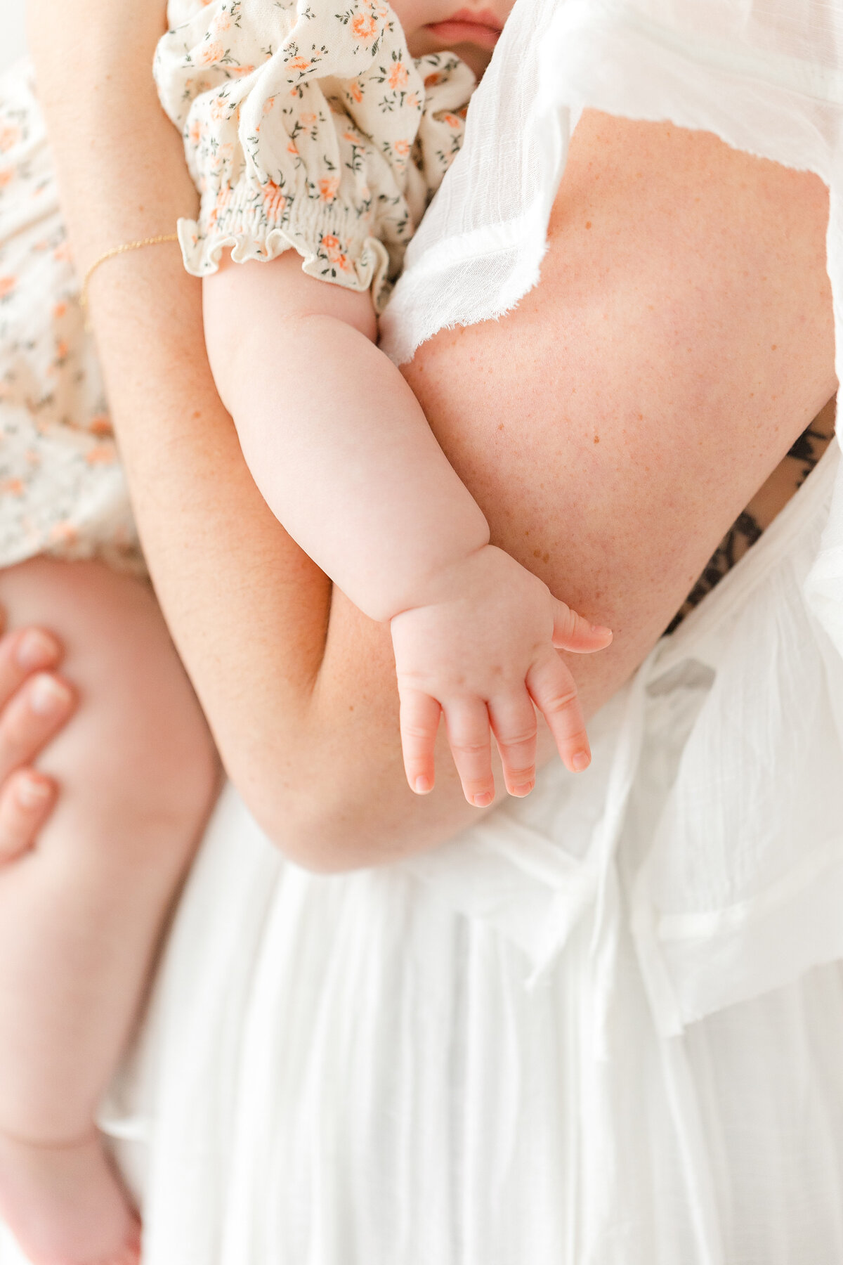 A closeup photo focused on a baby's hands by washington dc family photographer