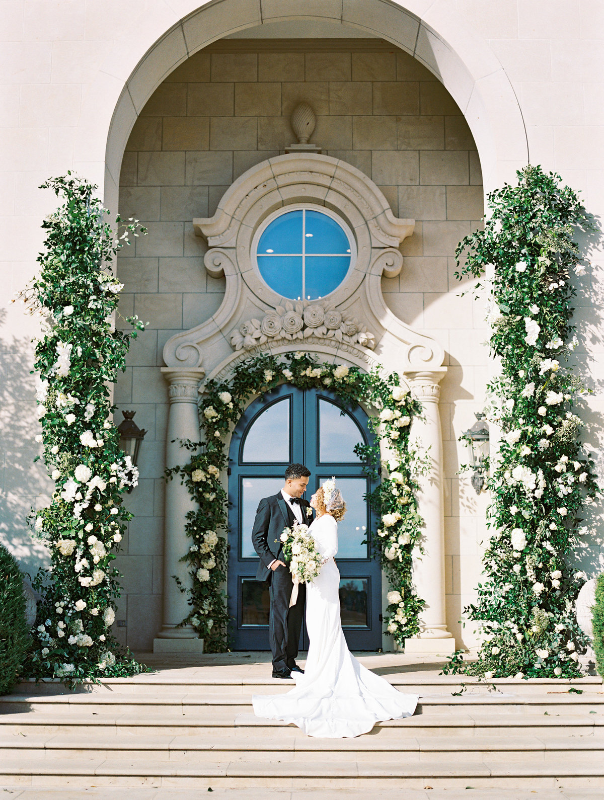 Romantic bride and groom portraits surrounded by lush floral at a Virginia Wedding Venue
