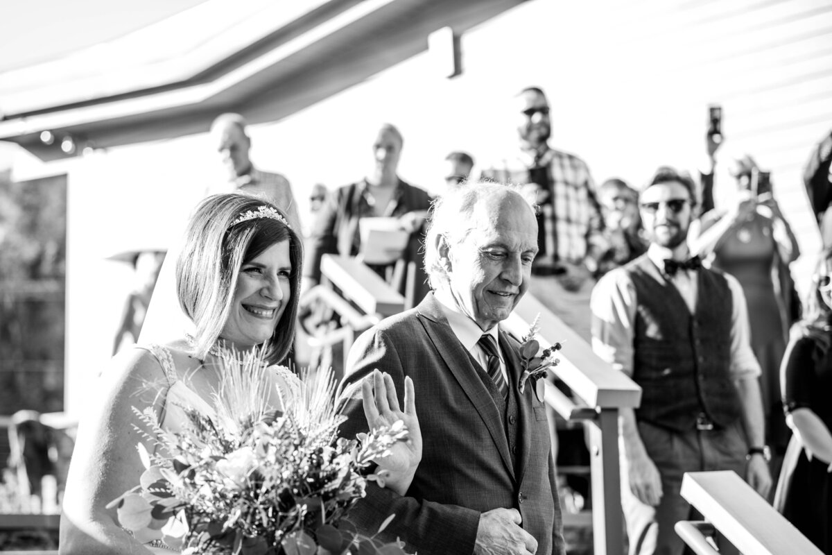 Bride and her father walk down the aisle