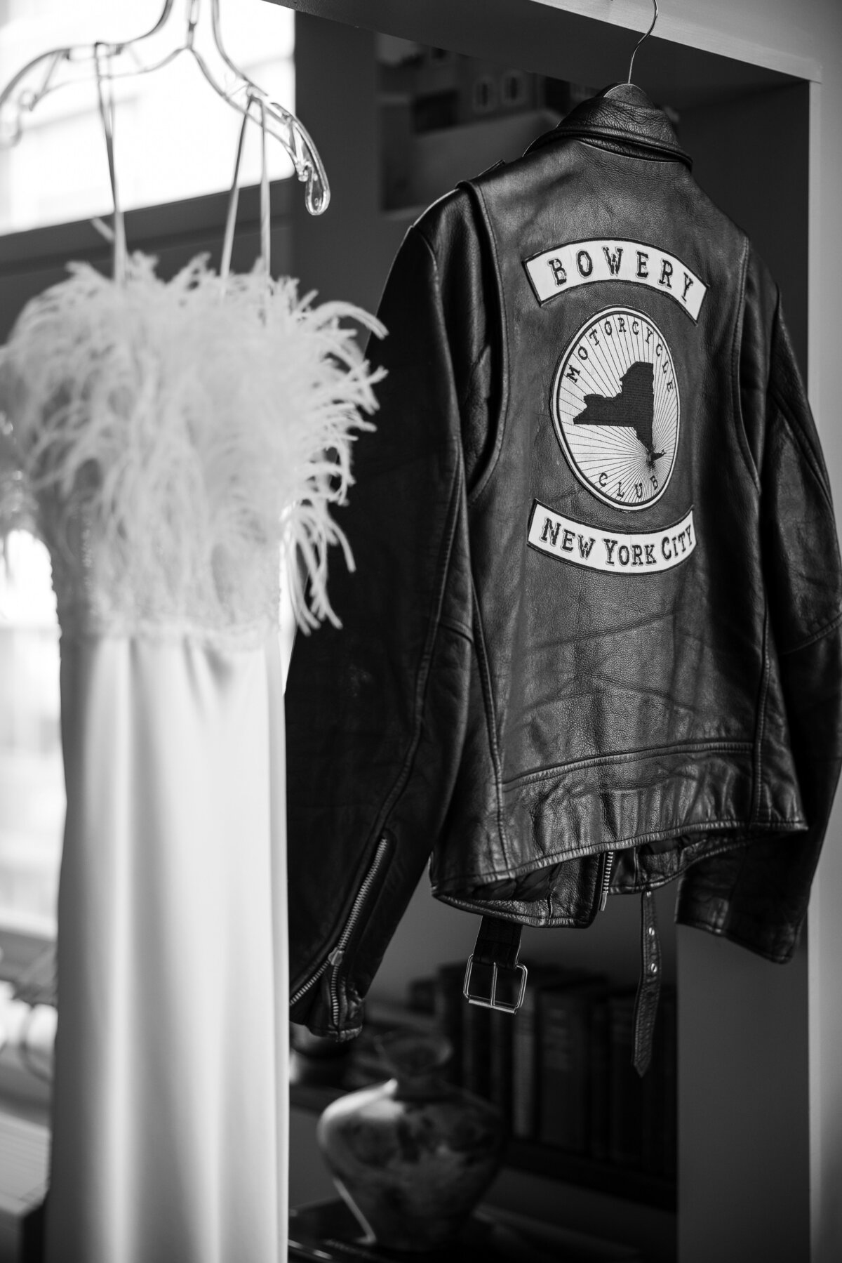 custom elizabeth fillmore wedding gown next to a black moto jacket