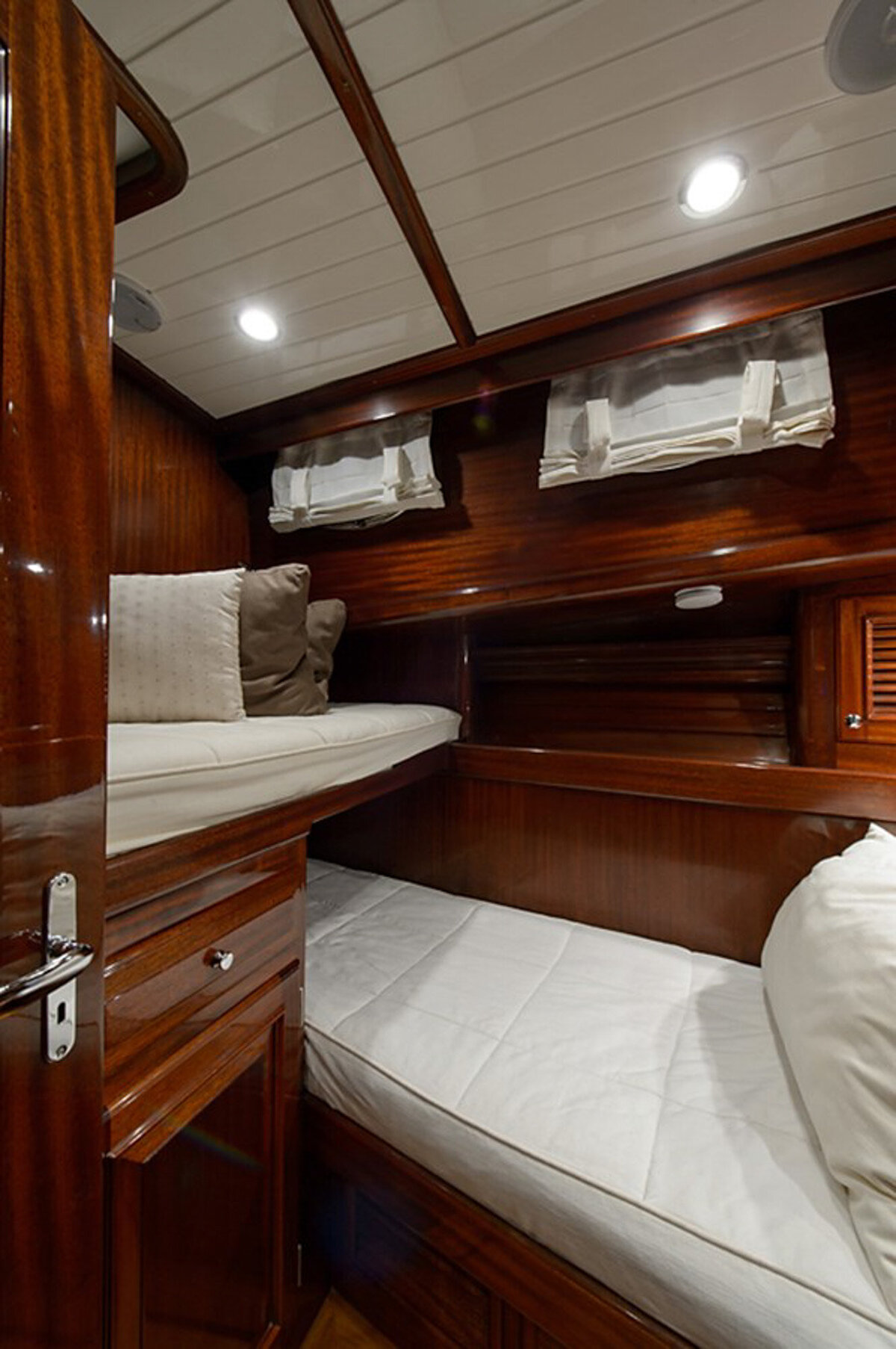 cozy wooden cabin with two single beds, one upper and one lower
