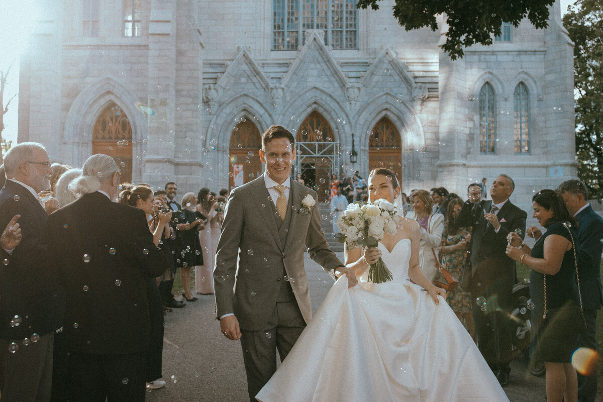bride-groom-church-exit-raphaelle-granger-luxury-wedding-photographer-montreal-toronto