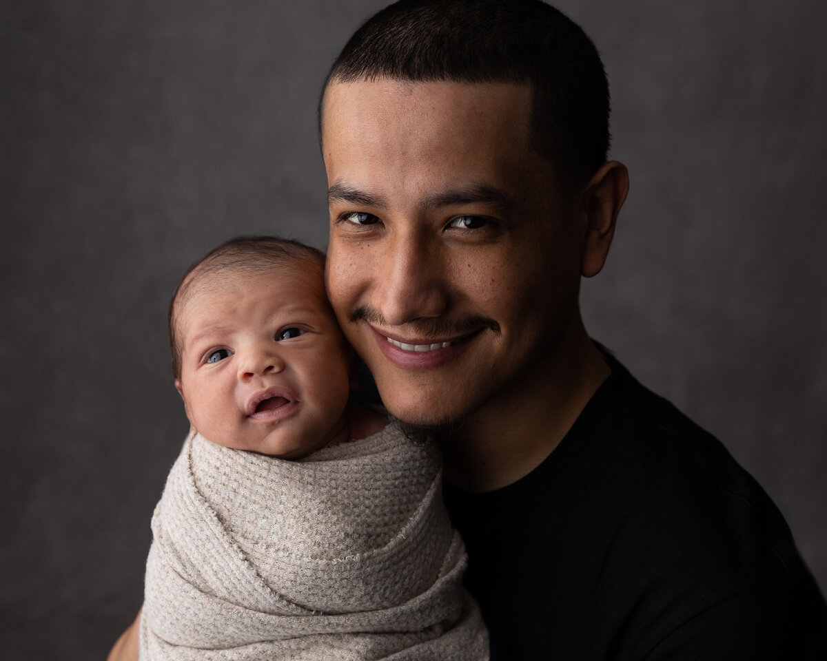 dad and son smiling