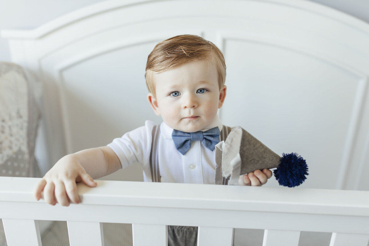 Birthday Photographer | One-year-old celebrating first birthday with family and balloons | Easton, Pennsylvania
