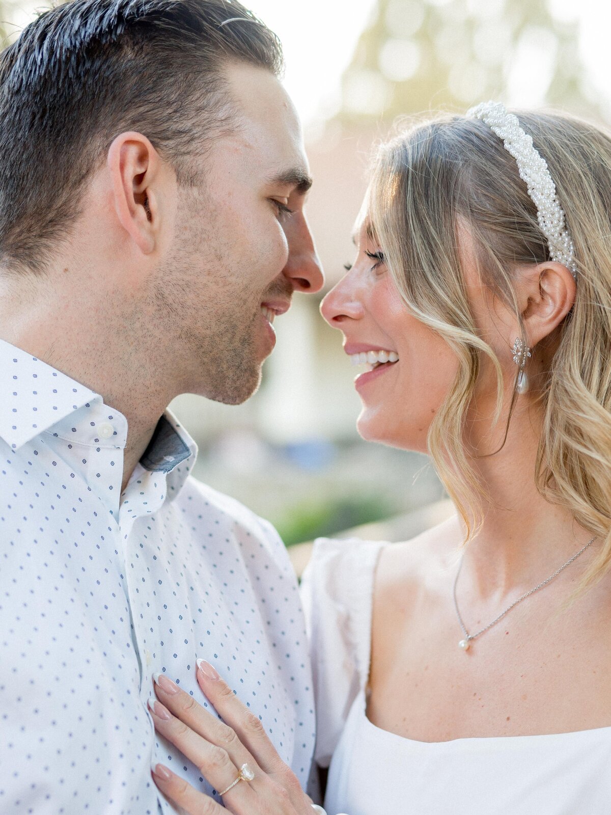 Close-up of joyful engaged couple in San Luis Obispo—romantic, playful, and full of natural connection.