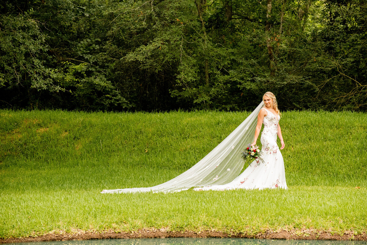 Experience the graceful and timeless elegance of a bride as she walks through the enchanting grounds of The Springs Event Venue in Katy, Texas, on her special day.