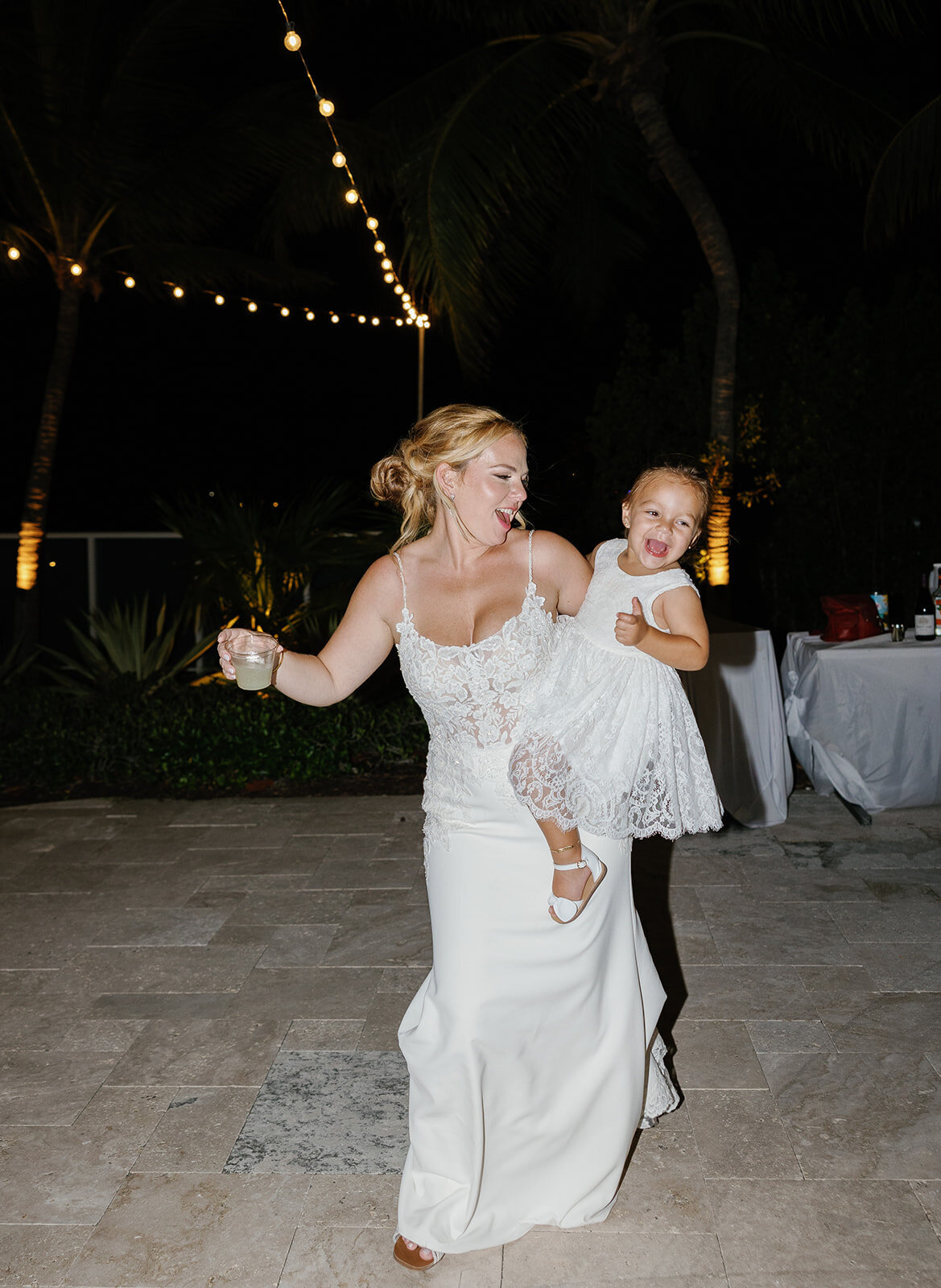 Sweet reception moment as Kelly dances with a little guest at La Siesta Marina Resort.