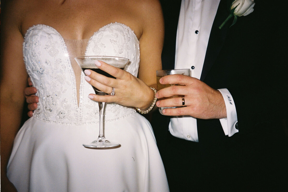 bride and groom holding drinks