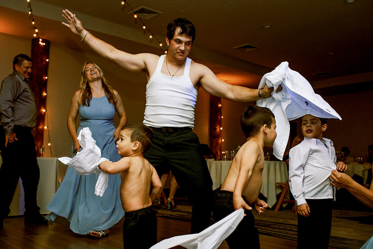 Groomsman cuts loose at a destination wedding in Breckenridge Colorado