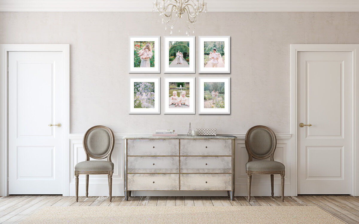 A foyer with a dresser and two chairs and six framed family photos hanging above