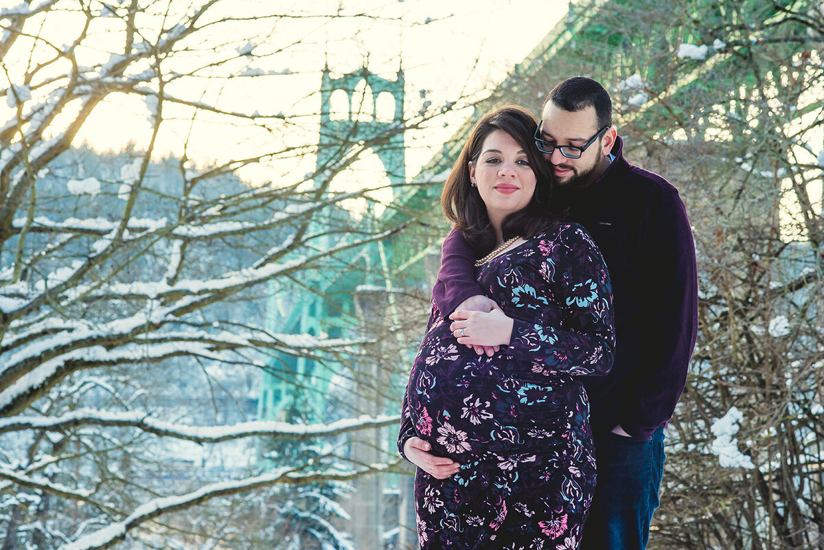 pregnant couple in snow