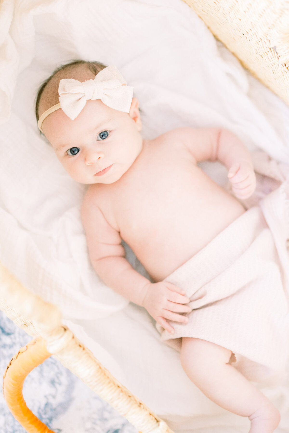 baby in headband for Tampa newborn photographer Tina Marie Studio.