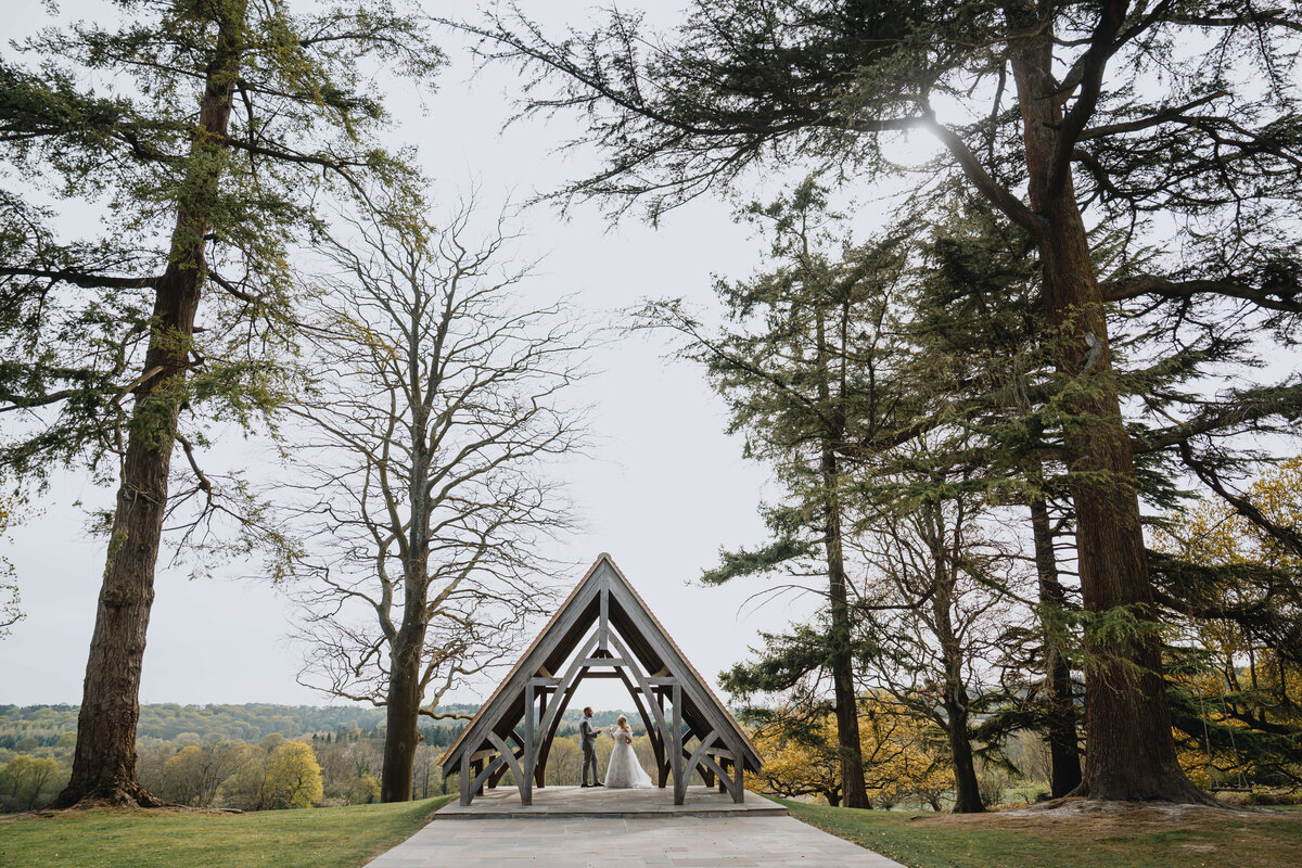 wedding-couple-inside-outdoor-ceremony-highly-manor