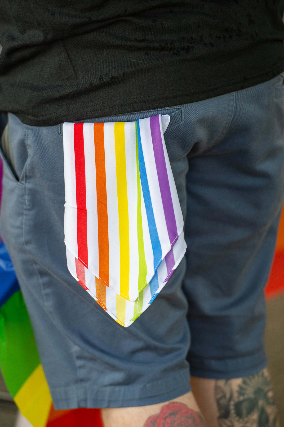 Ottawa event photos of a pride coloured tie hanging out of a pocket.  Captured by JEMMAN Photography COMMERCIAL