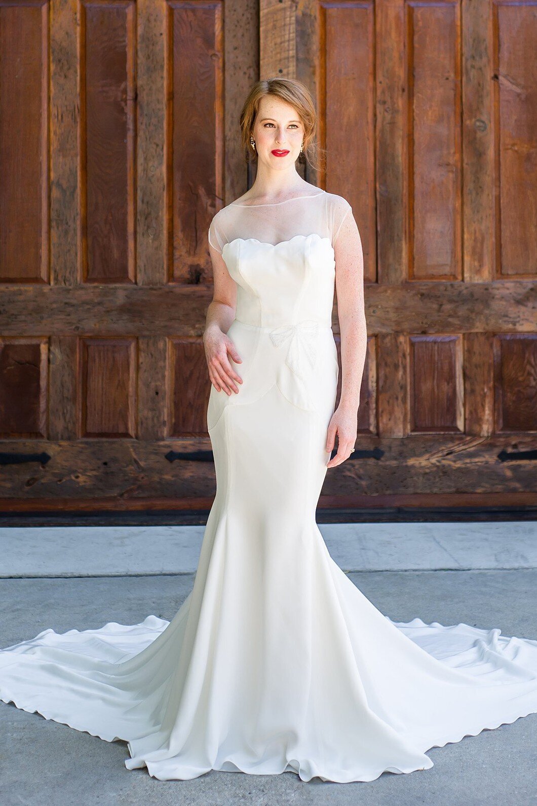 Zara is a mermaid crepe wedding gown with an illusion neckline by Charleston bridal designer Edith Elan.