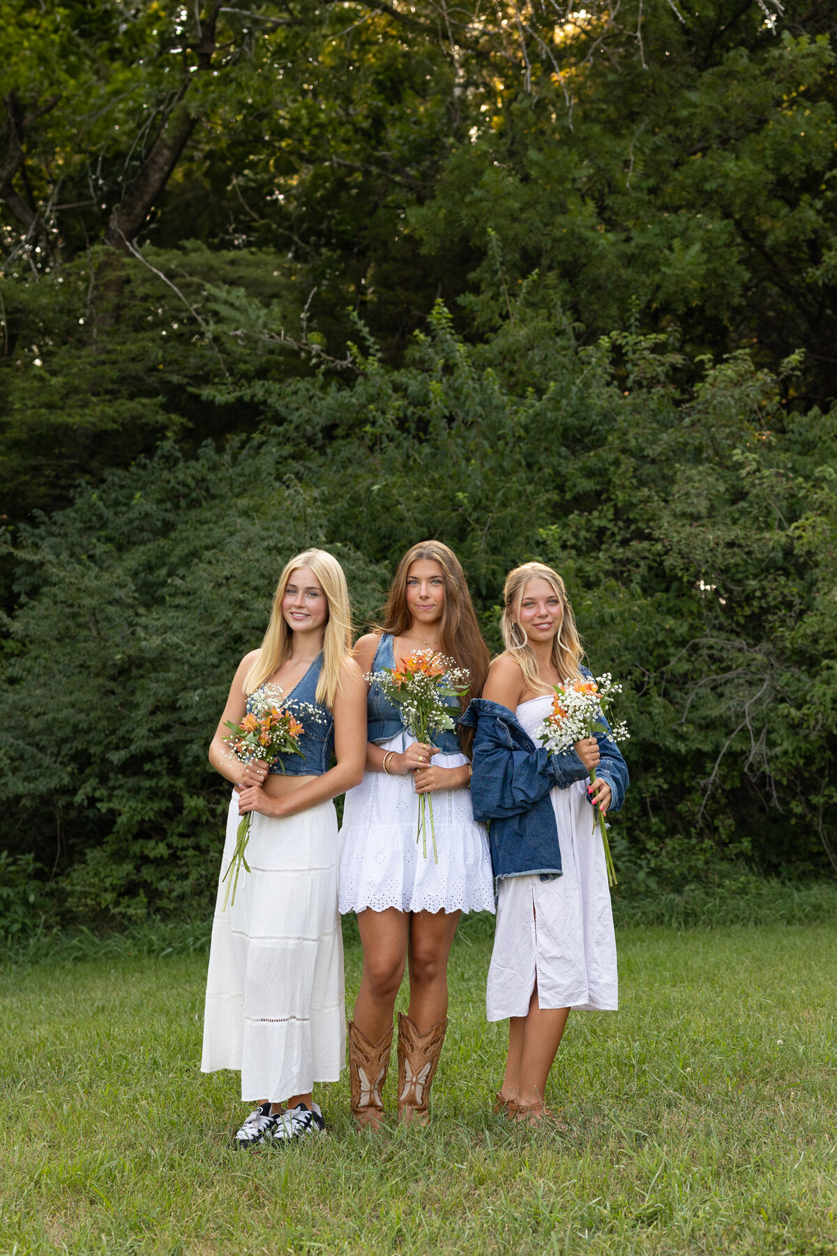 MBP Senior Team standing in front of trees with flowers in Lawrence, KS