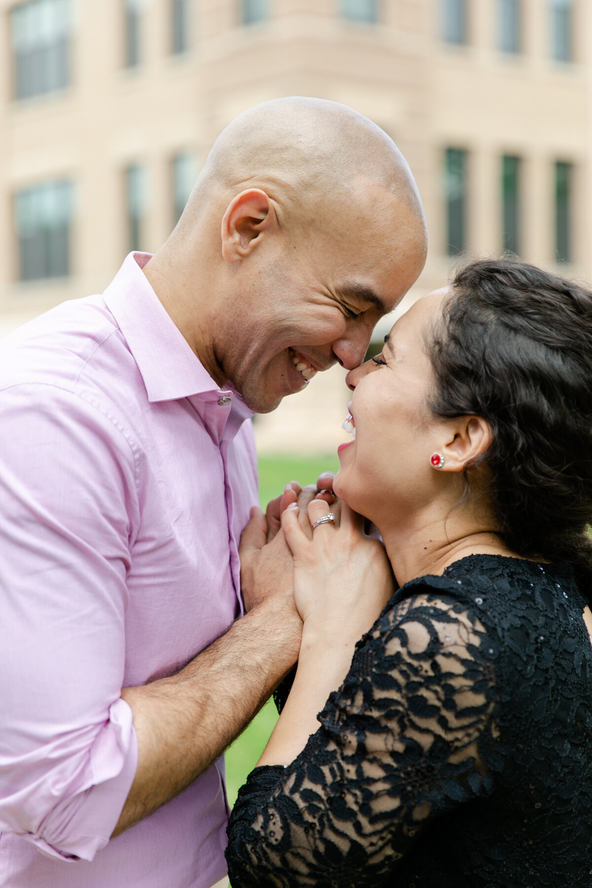 wedding videographer and engaged couple esquimo kiss laughing