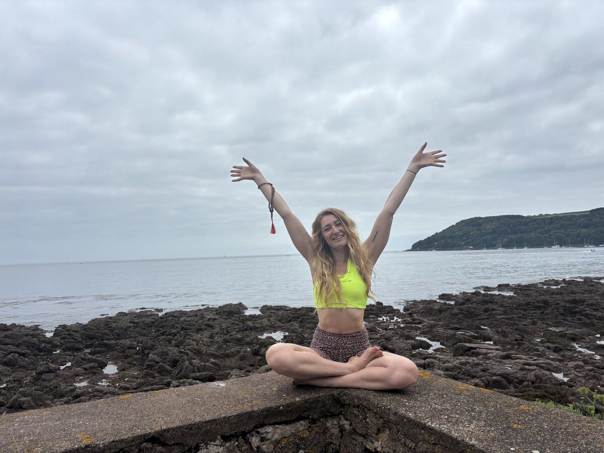 April the breathwork practioner starting a session near the beach.