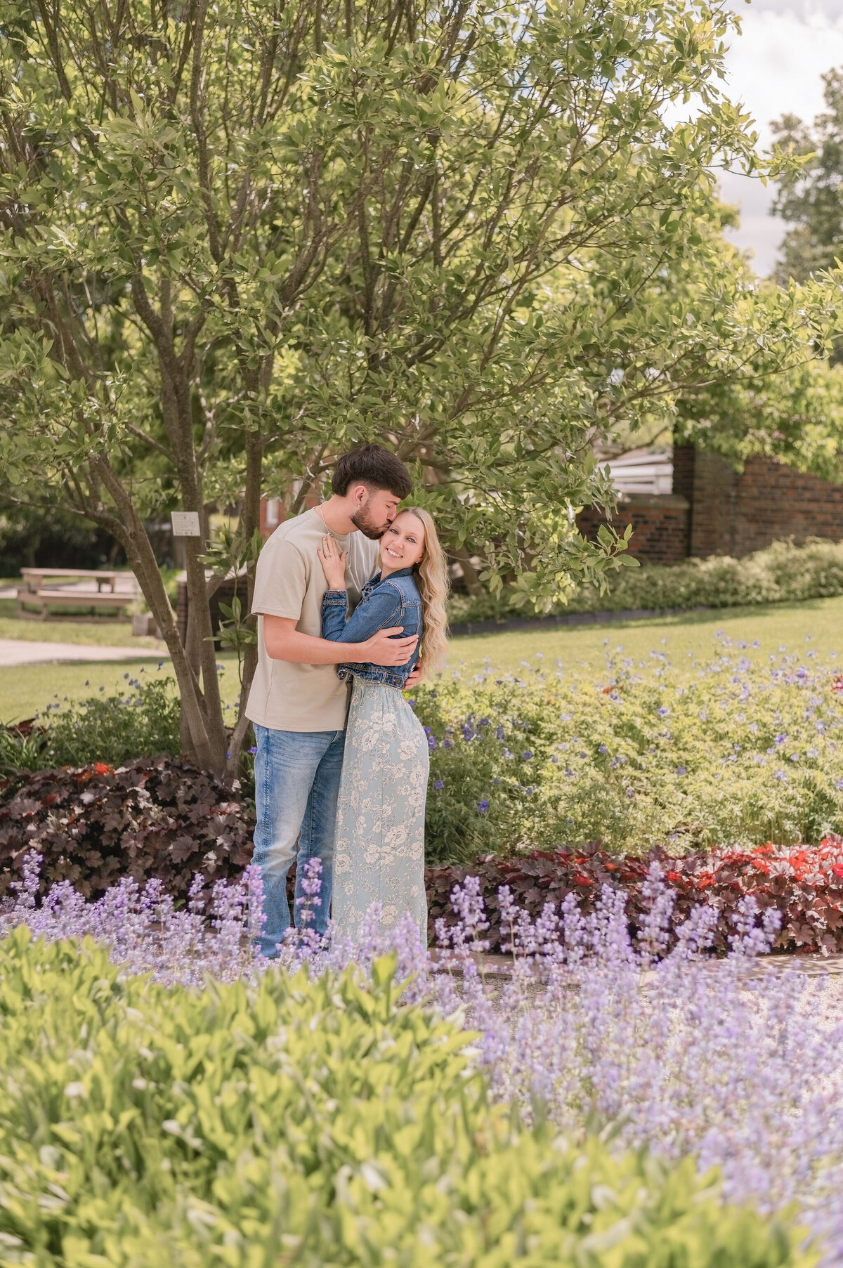 The Workmans snuggling during their couples session in Pittsburgh — captured by Bree Stewart of Lens Love Photography.