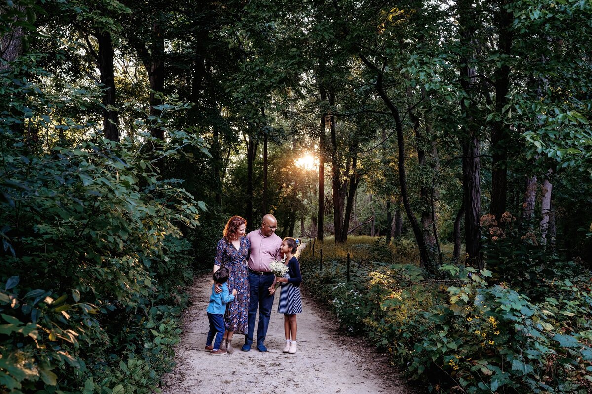 Family in forest with flowers McKennaPattersonPhotography