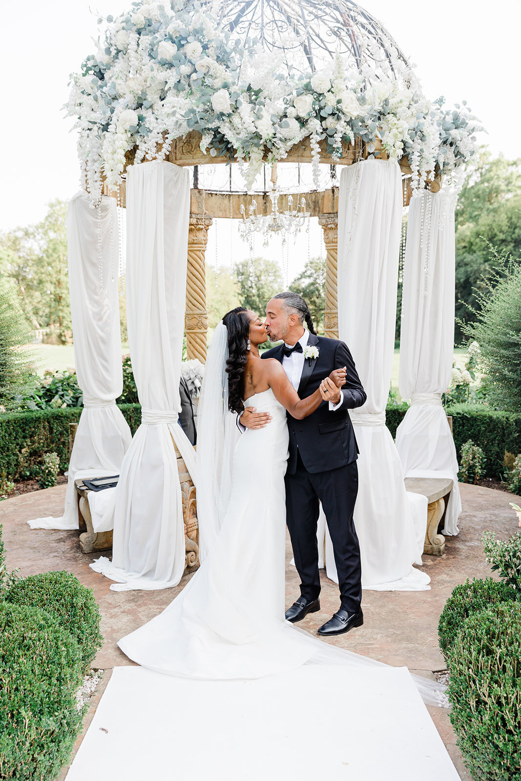 Bride and groom exchanging vows in a château garden during a romantic Loire Valley elopement