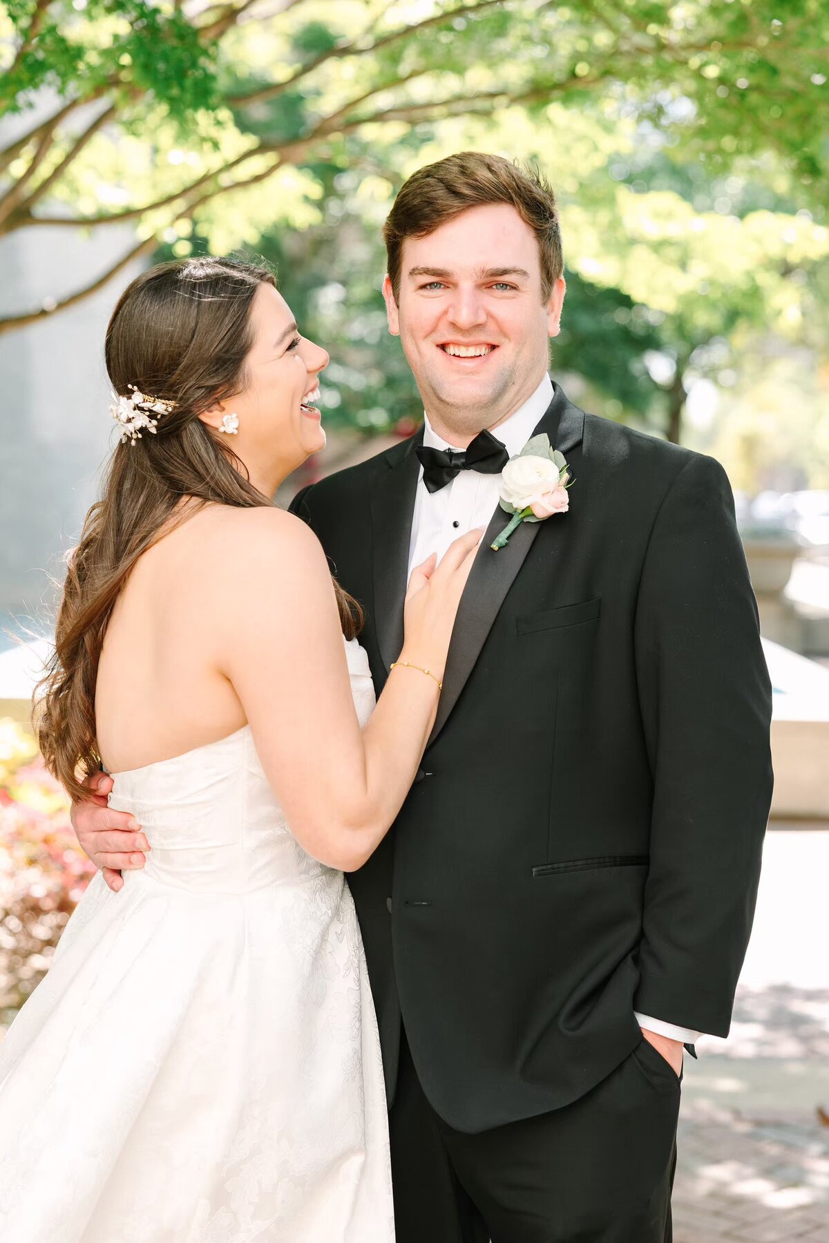 Bride looking at groom as both laugh